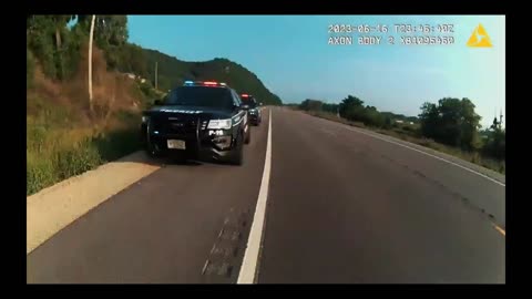 Cop jumps on side up truck. Goes for wild ride. Shoots the driver while going 55mph hanging on