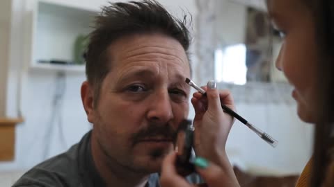 Doing my dad's makeup.