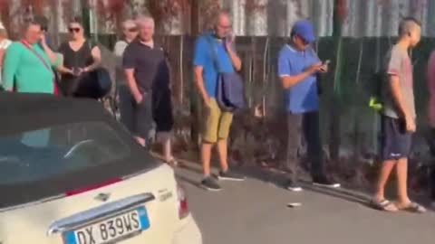 Hungry Italians Impoverished by Draghi's Italy Wait in Line for a Loaf of Bread and Some Milk