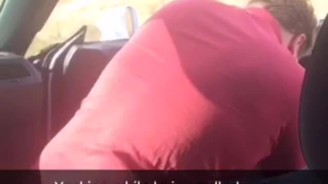 Guy red shirt throwing up while getting pulled over