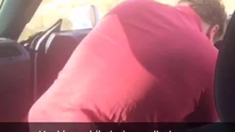 Guy red shirt throwing up while getting pulled over