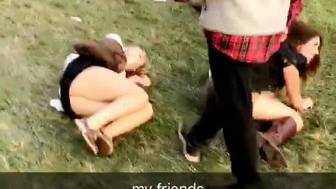 Girl in white knocks down drunk girl next to her