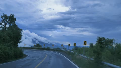 Going down a curved highway down a mountain