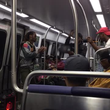 Men dancing and twisting body on train