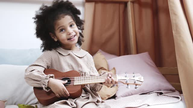 A beautiful girl playing the lute.