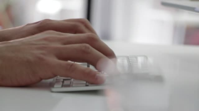 VIDEO INFORMATION Close Up Video Of Man Typing On A White Keyboard