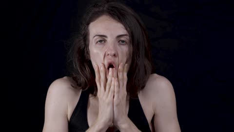 Woman pulling down her face