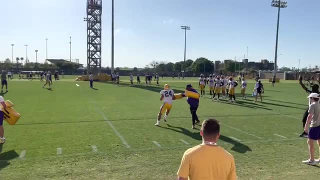 LSU wide receivers work with Cortez Hankton in RAC drill