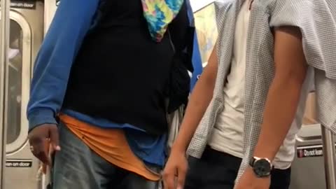 Man in blue shirt confronting man in white shirt