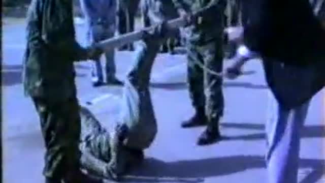 Iraqi Military Whipping Feet with Rods