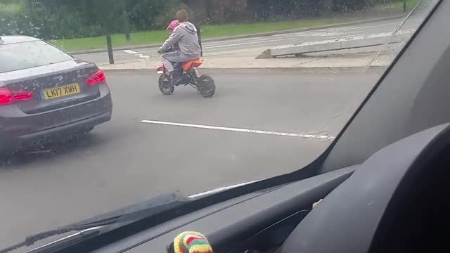 Biker Runs Red Light with Baby Onboard