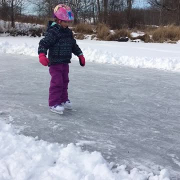 Girl Learning To Ice Skate Says It's Easy While Dad Falls Behind Her
