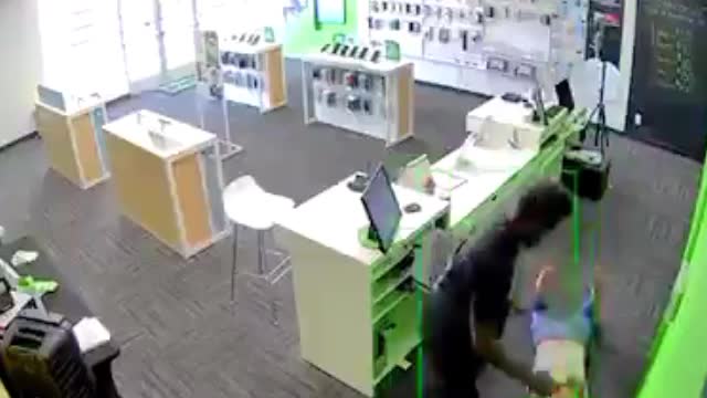 Negro savage walks into a cell phone store and starts beating the lone white woman