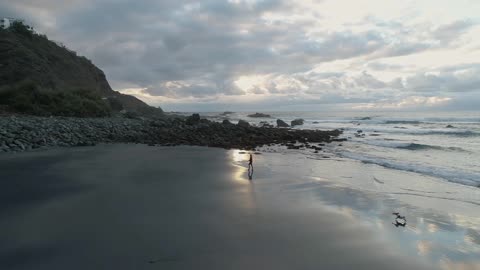 Person Jogging On a Beach