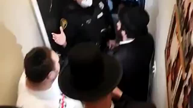 NYPD trying to stop a 10 person Jewish gathering.