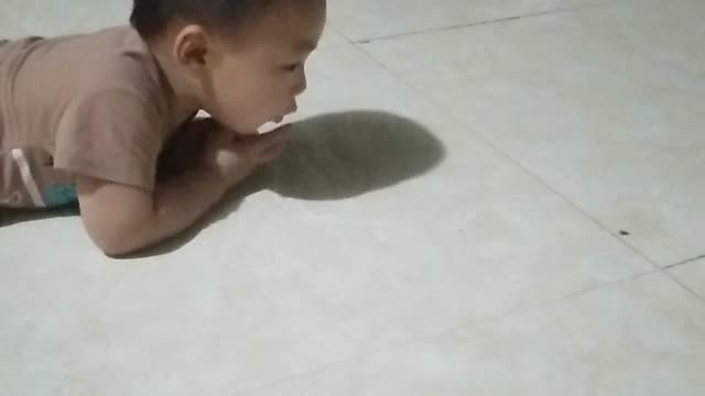 What is cute baby doing
