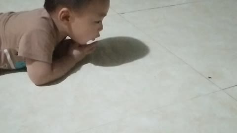 What is cute baby doing