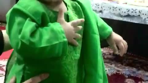 Little girl play wear green dress