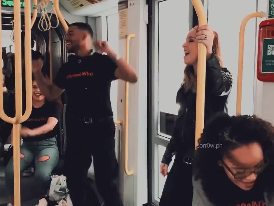 watch how easily these people turn a boring train ride into a musical sensation