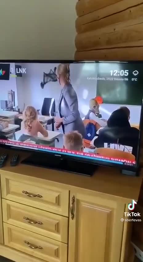Lithuanian - Child wears Gas Mask to school