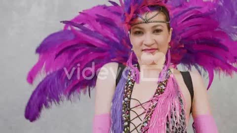 Zoom Out Of Young Woman Doing A Cabaret Dance In Pink And Purple Outfit