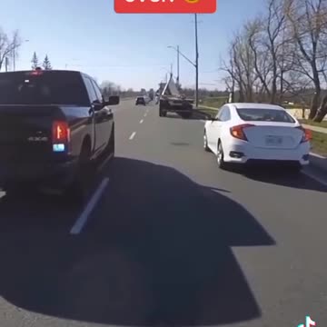 Care passes biker in same lane,then gets pulled over!