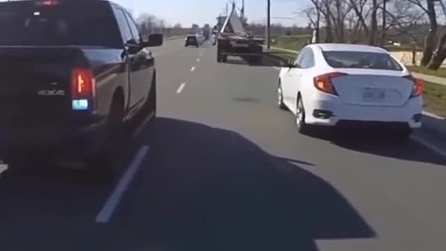 Care passes biker in same lane,then gets pulled over!