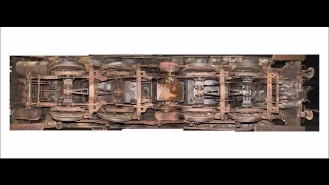 Filmmaker documents difficulties of filming underneath locomotive