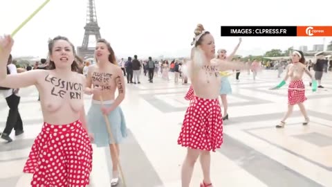 Topless French Feminists Protest Right-Wing Victory by Cleaning in Front of the Eiffel Tower