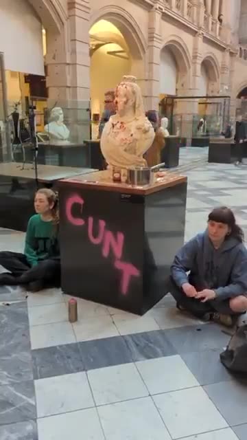 Idiots who were dragged up vandalize Queen Victoria's bust at Kelvingrove Art Gallery.