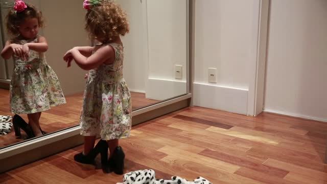 Little Girl Dances in Front of Mirror .... Cute Moment