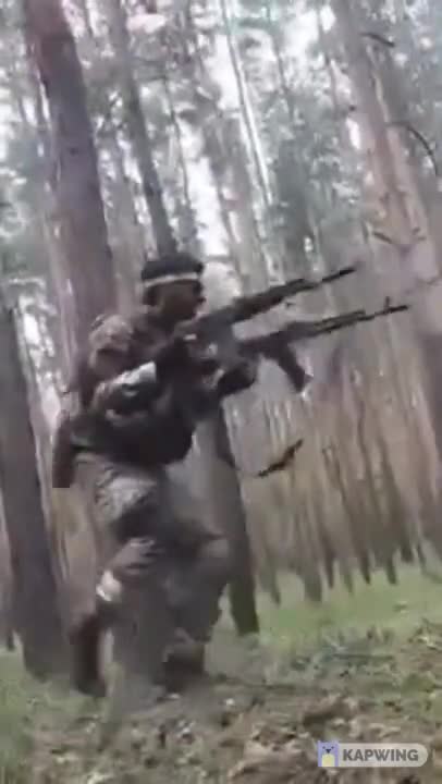 Chechen soldier fires double AKs!