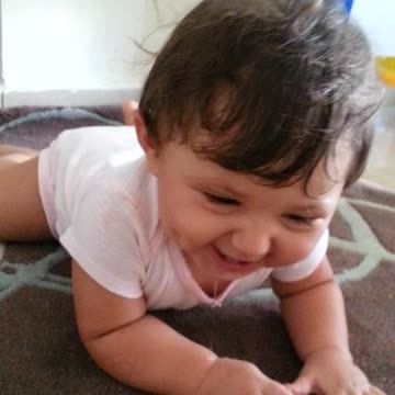 Baby laughs because Dad is making loud noises