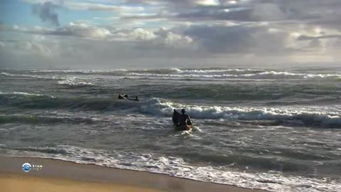 Fishermen in the ocean on funny fragile boats