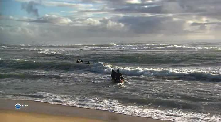 Fishermen in the ocean on funny fragile boats