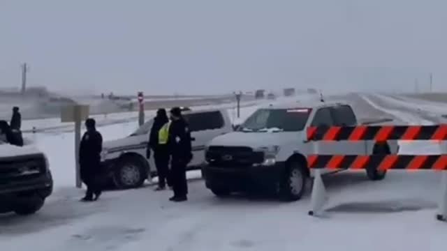 Farmers break through police barricades near Coutts, Canada