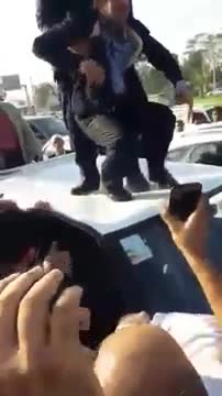 Ahmadinejad was lifted up by his bodyguard