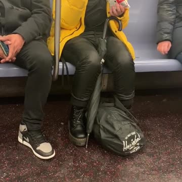Girl eats french fry chips with chopstick on subway train