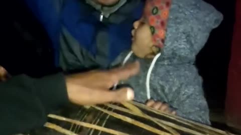 Baby playing with musical instruments