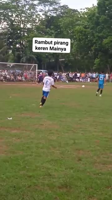 Football match between villages in a region in Indonesia