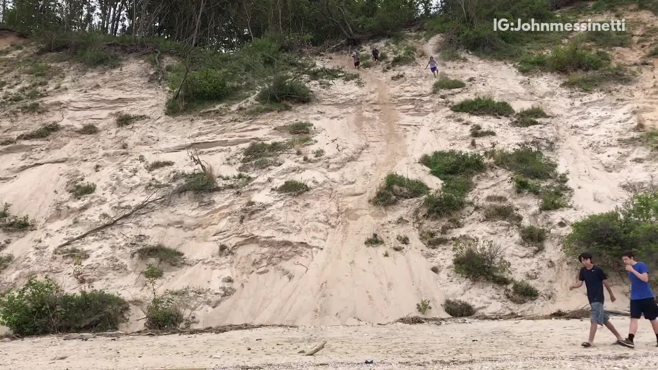 Three kids run down sand dune near beach one faceplants and scorpions