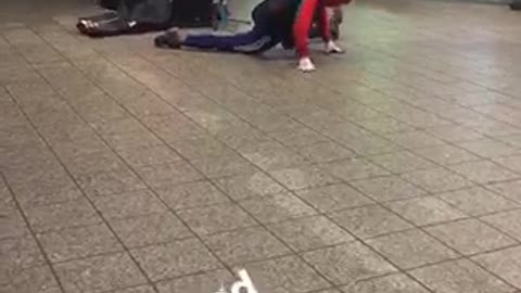 Person in spiderman outfit dances to subway music