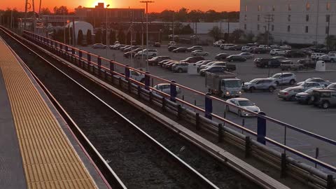 LIRR ends run in Hicksville with sunset in background