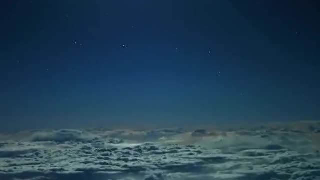 rare video of full moon above the clouds