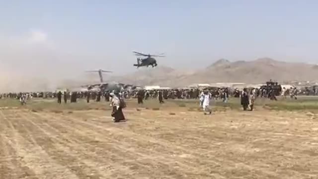 Helicopters Forced to Clear Kabul Runway as Afghans Try to Flee Almost Certain Death from Taliban