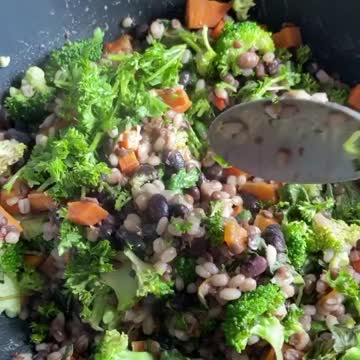 A Person Cooking A Vegetarian dish