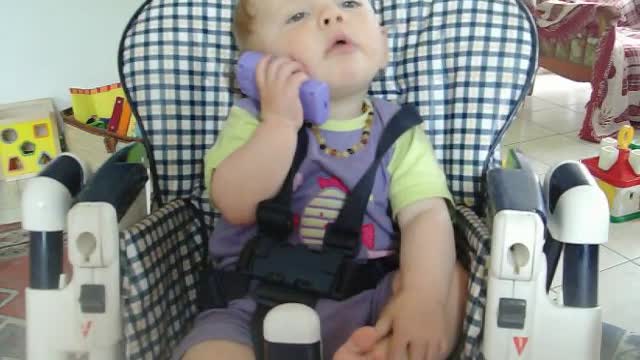 baby talking to his dad.