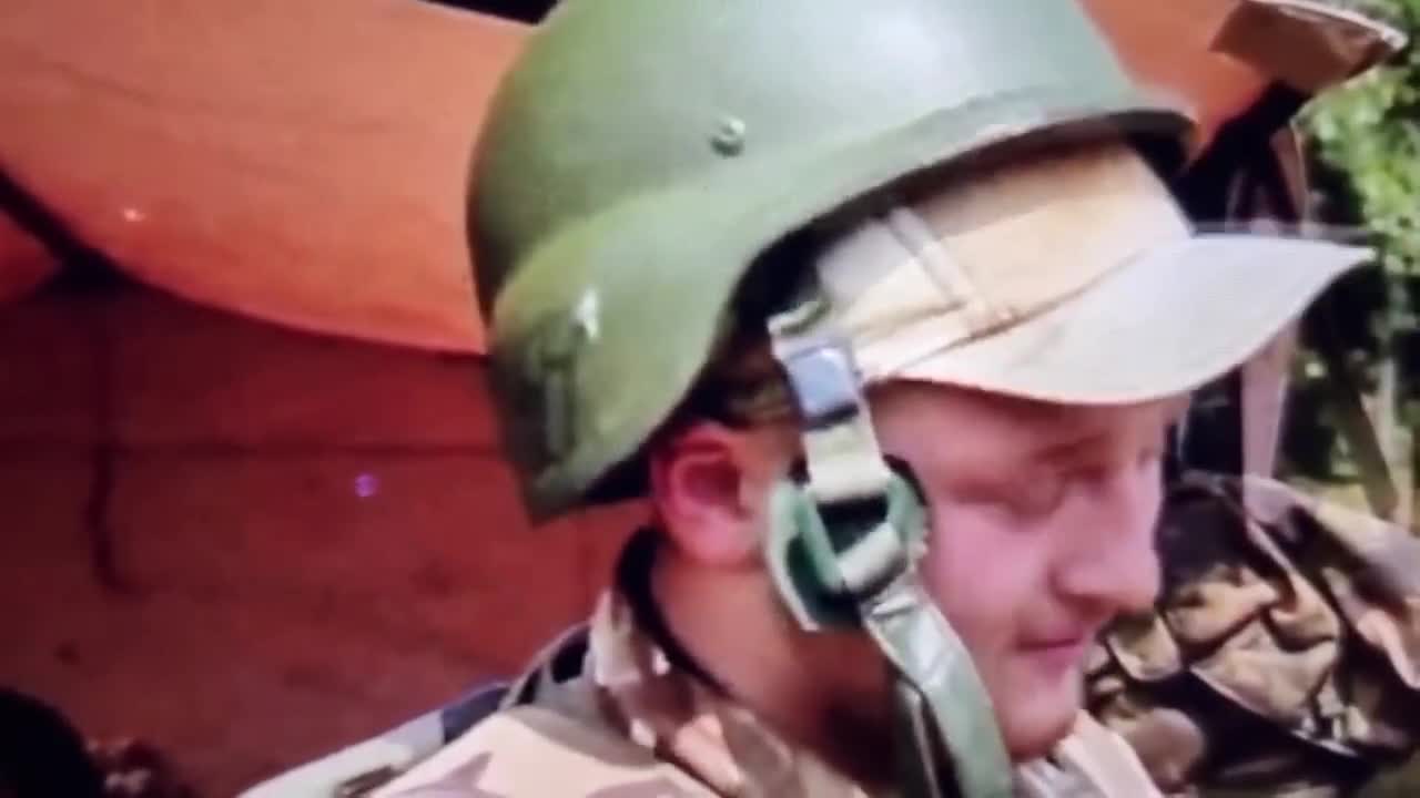 Ukrainian military man poses for TV in a helmet with SS runes.