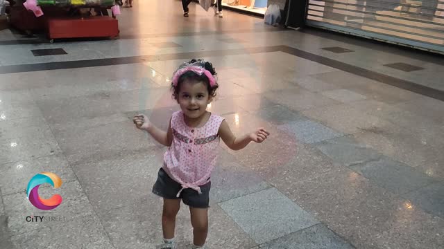Lilia in the mall dancing and singing