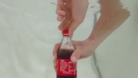 What happens if Coca-Cola is placed under water